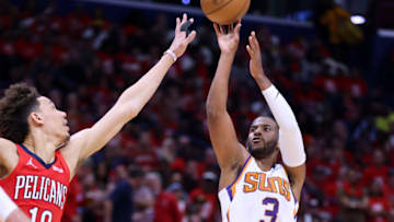 NEW ORLEANS, LOUISIANA - APRIL 22: Chris Paul #3 of the Phoenix Suns shoots the ball against Jaxson Hayes #10 of the New Orleans Pelicans during the first half of Game Three of the Western Conference First Round game at the Smoothie King Center on April 22, 2022 in New Orleans, Louisiana. NOTE TO USER: User expressly acknowledges and agrees that, by downloading and or using this Photograph, user is consenting to the terms and conditions of the Getty Images License Agreement. (Photo by Jonathan Bachman/Getty Images)