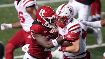 Rutgers Scarlet Knights defensive back Avery Young tackles Nebraska football quarterback (Vincent Carchietta-USA TODAY Sports)