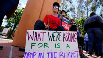 Chris Kyla lays down a beat on buckets as members of the Writers Guild of America picket in front of Disney Studios. The WGA is the union representing most writers for film and TV in the U.S., strike in Los Angeles. The strike comes after weeks of negotiations failed to generate a contract between the guild and the Alliance of Motion Picture and Television Producers (AMPTP), which bargains on behalf of the nine largest studios.