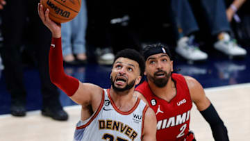 Jun 12, 2023; Denver, Colorado, USA; Denver Nuggets guard Jamal Murray (27) drives past Miami Heat guard Gabe Vincent (2) during the third quarter of game five of the 2023 NBA Finals at Ball Arena. Mandatory Credit: Isaiah J. Downing-USA TODAY Sports