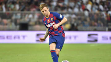 Barcelona's Croatian midfielder Ivan Rakitic passes the ball during the Spanish Super Cup semi final between Barcelona and Atletico Madrid on January 9, 2020, at the King Abdullah Sport City in the Saudi Arabian port city of Jeddah. - The winner will face Real Madrid in the final on January 12. (Photo by FAYEZ NURELDINE / AFP) (Photo by FAYEZ NURELDINE/AFP via Getty Images)
