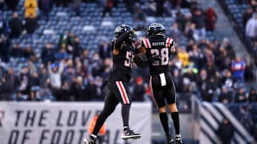 EAST RUTHERFORD, NEW JERSEY - FEBRUARY 09: Wesley Sutton #28 celebrates with Charles Wright #55 of the NY Guardians after sacking Quinton Flowers #9 of the Tampa Bay Vipers (not pictured) during the second half of their XFL game at MetLife Stadium on February 09, 2020 in East Rutherford, New Jersey. The NY Guardians won, 23-3. (Photo by Michael Owens/Getty Images)