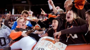 Oct 26, 2014; Cleveland, OH, USA; Cleveland Browns wide receiver Andrew Hawkins (16) celebrates with fans in the Dawg Pound after scoring a touchdown during the fourth quarter against the Oakland Raiders at FirstEnergy Stadium. The Browns beat the Raiders 23-13. Mandatory Credit: Ken Blaze-USA TODAY Sports