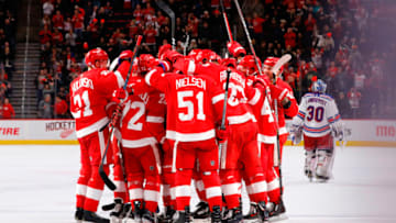 Nov 9, 2018; Detroit, MI, USA; Detroit Red Wings center Dylan Larkin (71) is congratulated by teammates after scoring in overtime against the New York Rangers at Little Caesars Arena. Mandatory Credit: Rick Osentoski-USA TODAY Sports