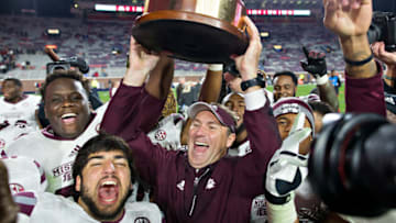 OXFORD, MS - NOVEMBER 26: Head Coach Dan Mullen of the Mississippi State Bulldogs celebrates with his team after winning the Egg Bowl against the Mississippi Rebels at Vaught-Hemingway Stadium on November 26, 2016 in Oxford, Mississippi. The Bulldogs defeated the Rebels 55-20. (Photo by Wesley Hitt/Getty Images)