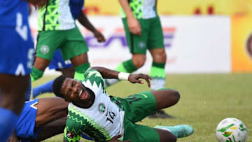 Nigeria and Leicester City forward Kelechi Iheanacho reacts to an injury (Photo by PIUS UTOMI EKPEI / AFP) (Photo by PIUS UTOMI EKPEI/AFP via Getty Images)