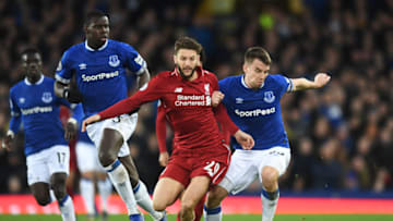 LIVERPOOL, ENGLAND - MARCH 03: Seamus Coleman of Everton and Adam Lallana of Liverpool battle for the ball during the Premier League match between Everton FC and Liverpool FC at Goodison Park on March 03, 2019 in Liverpool, United Kingdom. (Photo by Michael Regan/Getty Images)