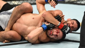 UTICA, NY - JUNE 01: (R-L) Julio Arce attempts to submit Daniel Teymur of Sweden in their featherweight fight during the UFC Fight Night event at the Adirondack Bank Center on June 1, 2018 in Utica, New York. (Photo by Josh Hedges/Zuffa LLC/Zuffa LLC via Getty Images)