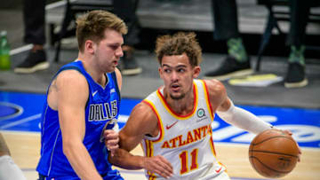 Feb 10, 2021; Dallas, Texas, USA; Dallas Mavericks guard Luka Doncic (77) defends against Atlanta Hawks guard Trae Young (11) during the first quarter at the American Airlines Center. Mandatory Credit: Jerome Miron-USA TODAY Sports