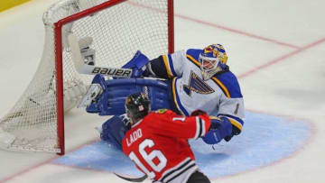 Apr 23, 2016; Chicago, IL, USA; St. Louis Blues goalie Brian Elliott (1) makes a save on a shot from Chicago Blackhawks left wing Andrew Ladd (16) during the third period in game six of the first round of the 2016 Stanley Cup Playoffs at the United Center. Chicago won 6-3. Mandatory Credit: Dennis Wierzbicki-USA TODAY Sports