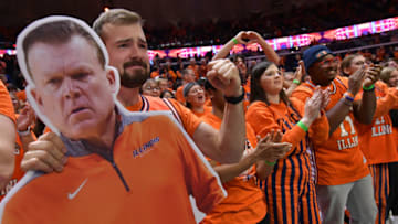 Dec 10, 2022; Champaign, Illinois, USA; Illinois fighting Illini fans cheer on their team during the first half against the Penn State Nittany Lions at State Farm Center. Mandatory Credit: Ron Johnson-USA TODAY Sports