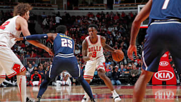 CHICAGO, IL - OCTOBER 12: Antonio Blakeney #9 of the Chicago Bulls dribbles the ball against the Denver Nuggets during a pre-season game on October 12, 2018 at the United Center in Chicago, Illinois. NOTE TO USER: User expressly acknowledges and agrees that, by downloading and or using this Photograph, user is consenting to the terms and conditions of the Getty Images License Agreement. Mandatory Copyright Notice: Copyright 2018 NBAE (Photo by Jeff Haynes/NBAE via Getty Images)