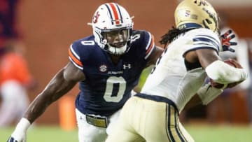 Auburn football linebacker Owen Pappoe (0) pressures the quarterback at Jordan-Hare Stadium in Auburn, Ala., on Saturday, Sept. 4, 2021. Auburn Tigers leads Akron Zips 37-0.