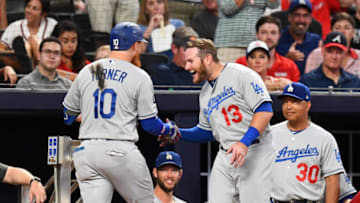 ATLANTA, GA - AUGUST 16: Justin Turner #10 of the Los Angeles Dodgers is congratulated by Max Muncy #13 after hitting back-to-back home runs in the seventh inning against the Atlanta Braves at SunTrust Park on August 16, 2019 in Atlanta, Georgia. (Photo by Scott Cunningham/Getty Images)