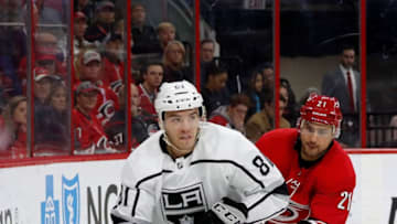 RALEIGH, NC - FEBRUARY 26: Matt Roy #81 of the Los Angeles Kings controls the puck as Nino Niederreiter #21 of the Carolina Hurricanes chases during an NHL game on February 26, 2019 at PNC Arena in Raleigh, North Carolina. (Photo by Karl DeBlaker/NHLI via Getty Images)