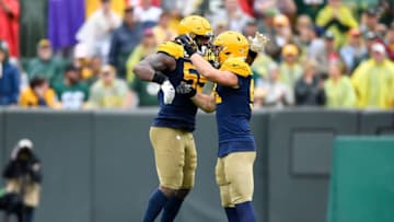 GREEN BAY, WISCONSIN - SEPTEMBER 22: Za'Darius Smith #55 of the Green Bay Packers celebrates with Kyler Fackrell #51 of the Green Bay Packers after his tackled in the fourth quarter against the Denver Broncos at Lambeau Field on September 22, 2019 in Green Bay, Wisconsin. (Photo by Quinn Harris/Getty Images)