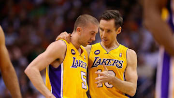 PHOENIX, AZ - MARCH 18: Steve Nash #10 of the Los Angeles Lakers talks with Steve Blake #5 during the first half of the NBA game against the Phoenix Suns at US Airways Center on March 18, 2013 in Phoenix, Arizona. NOTE TO USER: User expressly acknowledges and agrees that, by downloading and or using this photograph, User is consenting to the terms and conditions of the Getty Images License Agreement. (Photo by Christian Petersen/Getty Images)