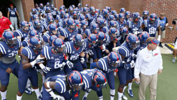 OXFORD, MS - SEPTEMBER 13: The Ole Miss Rebels and Head Coach Hugh Freeze prepare to run onto the field before a game against the Louisiana-Lafayette Ragin' Cajuns at Vaught-Hemingway Stadium on September 13, 2014 in Oxford, Mississippi. (Photo by Wesley Hitt/Getty Images)