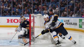 BUFFALO, NY - DECEMBER 10: Jordan Kyrou #33 of the St. Louis Blues attempts a wrap-around against Linus Ullmark #35 of the Buffalo Sabres during an NHL game on December 10, 2019 at KeyBank Center in Buffalo, New York. (Photo by Bill Wippert/NHLI via Getty Images)