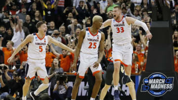 LOUISVILLE, KENTUCKY - MARCH 30: Mamadi Diakite #25 of the Virginia Cavaliers celebrates after making a game-tying shot over Matt Haarms #32 of the Purdue Boilermakers to extend the game to overtime as time expires in the second half of the 2019 NCAA Men's Basketball Tournament South Regional at KFC YUM! Center on March 30, 2019 in Louisville, Kentucky. (Photo by Kevin C. Cox/Getty Images)