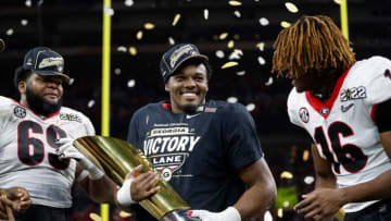 Georgia Bulldogs linebacker Nakobe Dean (17) celebrates with the trophy after winning the College Football Playoff National Championship. Syndication: The Indianapolis Star