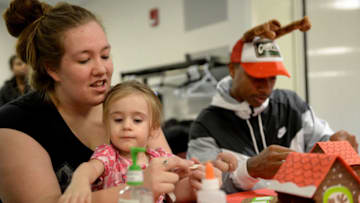 BOSTON, MA - DECEMBER 01: Boston Celtics Isaiah Thomas builds a ginger bread house with Isabella and Mom at Boston Children's Hospital on December 1, 2016 in Boston, Massachusetts. (Photo by Darren McCollester/Getty Images for Boston Children's Hospital)