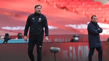 LONDON, ENGLAND - APRIL 18: Ralph Hasenhuettl, Manager of Southampton reacts as Brendan Rogers, Manager of Leicester City looks on during the Semi Final of the Emirates FA Cup between Leicester City and Southampton FC at Wembley Stadium on April 18, 2021 in London, England. 4000 local residents have been permitted to attend the match as part of the government's Events Research Programme, which will study how to safely hold major events once coronavirus lockdown measures are eased. Other sporting events around the United Kingdom continue to be played behind closed doors. (Photo by Neil Hall - Pool/Getty Images)