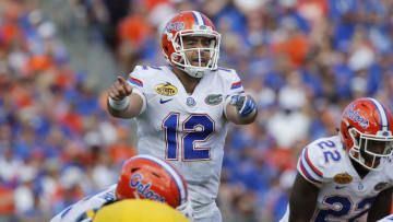 Jan 2, 2017; Tampa , FL, USA; Florida Gators quarterback Austin Appleby (12) points against the Iowa Hawkeyes during the first half at Raymond James Stadium. Mandatory Credit: Kim Klement-USA TODAY Sports