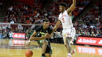 Dec 30, 2016; Norman, OK, USA; Baylor Bears guard King McClure (22) handles the ball in front of Oklahoma Sooners guard Christian James (3) during the first half at Lloyd Noble Center. Mandatory Credit: Mark D. Smith-USA TODAY Sports