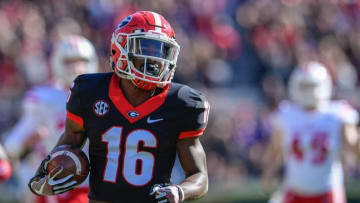 Nov 19, 2016; Athens, GA, USA; Georgia Bulldogs wide receiver Isaiah McKenzie (16) returns a punt for a touchdown against the Louisiana-Lafayette Ragin Cajuns during the first half at Sanford Stadium. Georgia defeated Louisiana-Lafayette 35-21. Mandatory Credit: Dale Zanine-USA TODAY Sports