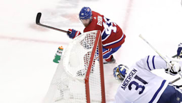 TORONTO, ONTARIO - JULY 28: Paul Byron #41 of the Montreal Canadiens gets the puck past Frederik Andersen #31 of the Toronto Maple Leafs in the third period during an exhibition game prior to the 2020 NHL Stanley Cup Playoffs at Scotiabank Arena on July 28, 2020 in Toronto, Ontario. (Photo by Andre Ringuette/Freestyle Photo/Getty Images)