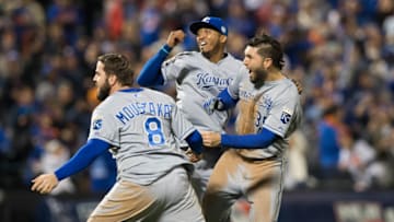 NEW YORK, NY - NOVEMBER 1: Mike Moustakas #8, Eric Hosmer #35 and Alcides Escobar #2 of the Kansas City Royals celebrate on the field after defeating the New York Mets in Game 5 of the 2015 World Series at Citi Field on Sunday, November 1, 2015 in the Queens borough of New York City. (Photo by Rob Tringali/MLB Photos via Getty Images)