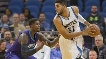 Nov 15, 2016; Minneapolis, MN, USA; Minnesota Timberwolves center Karl-Anthony Towns (32) looks past Charlotte Hornets forward Marvin Williams (2) towards the basket in the first half at Target Center. Mandatory Credit: Jesse Johnson-USA TODAY Sports