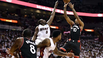 May 9, 2016; Miami, FL, USA; Toronto Raptors guard DeMar DeRozan (10) shoots over Miami Heat forward Luol Deng (9) during the second quarter in game four of the second round of the NBA Playoffs at American Airlines Arena. Mandatory Credit: Steve Mitchell-USA TODAY Sports