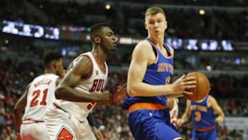 Jan 1, 2016; Chicago, IL, USA; New York Knicks forward Kristaps Porzingis (6)is defended by Chicago Bulls forward Bobby Portis (5) during the second half at United Center. The Bulls won 108-81. Mandatory Credit: Kamil Krzaczynski-USA TODAY Sports