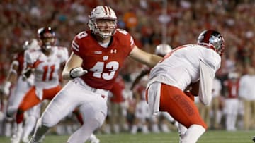 MADISON, WI - AUGUST 31: Ryan Connelly #43 of the Wisconsin Badgers sacks Drew Eckels #4 of the Western Kentucky Hilltoppers in the first quarter at Camp Randall Stadium on August 31, 2018 in Madison, Wisconsin. (Photo by Dylan Buell/Getty Images)