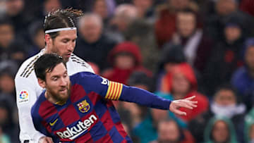 MADRID, SPAIN - MARCH 01: Sergio Ramos of Real Madrid competes for the ball with Lionel Messi of FC Barcelona during the La Liga match between Real Madrid CF and FC Barcelona at Estadio Santiago Bernabeu on March 01, 2020 in Madrid, Spain. (Photo by Mateo Villalba/Quality Sport Images/Getty Images)