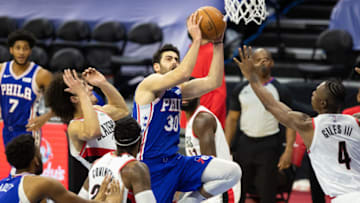Feb 4, 2021; Philadelphia, Pennsylvania, USA; Philadelphia 76ers guard Furkan Korkmaz (30) drives for a shot against Portland Trail Blazers guard CJ Elleby (16) and forward Harry Giles III (4) during the fourth quarter at Wells Fargo Center. Mandatory Credit: Bill Streicher-USA TODAY Sports