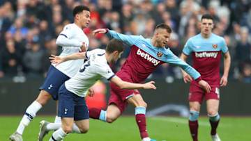 LONDON, ENGLAND - NOVEMBER 23: Andriy Yarmolenko of West Ham United battles for possession with Ben Davies of Tottenham Hotspur during the Premier League match between West Ham United and Tottenham Hotspur at London Stadium on November 23, 2019 in London, United Kingdom. (Photo by Catherine Ivill/Getty Images)