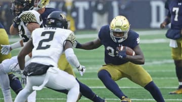 SOUTH BEND, IN - NOVEMBER 04: Tony Jones Jr. #34 of the Notre Dame Fighting Irish runs at Cameron Glenn #2 of the Wake Forest Demon Deacons at Notre Dame Stadium on November 4, 2017 in South Bend, Indiana. (Photo by Jonathan Daniel/Getty Images)