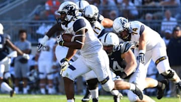 STATE COLLEGE, PA - SEPTEMBER 3: Justin Rankin #11 of the Kent State Golden Flashes carries the ball past Robert Windsor #54 of the Penn State Nittany Lions at Beaver Stadium on September 3, 2016 in State College, Pennsylvania. (Photo by Joe Sargent/Getty Images)