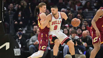 CLEVELAND, OHIO - DECEMBER 08: Nikola Vucevic #9 of the Chicago Bulls posts up against Lauri Markkanen #24 of the Cleveland Cavaliers during the second quarter at Rocket Mortgage Fieldhouse on December 08, 2021 in Cleveland, Ohio. NOTE TO USER: User expressly acknowledges and agrees that, by downloading and/or using this photograph, user is consenting to the terms and conditions of the Getty Images License Agreement. (Photo by Jason Miller/Getty Images)