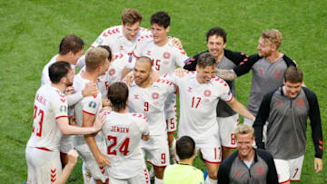 Denmark's players celebrate their win against Wales (Photo by KOEN VAN WEEL/POOL/AFP via Getty Images)