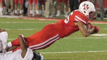 Oct 15, 2016; Houston, TX, USA; Houston Cougars running back Dillon Birden (25) is tackled by Tulsa Golden Hurricane cornerback Keidrien Wadley (11) in the second half at TDECU Stadium. Houston Cougars won 38 to 31. Mandatory Credit: Thomas B. Shea-USA TODAY Sports