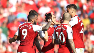 LONDON, ENGLAND - MAY 06: Alexandre Lacazette of Arsenal celebrates after scoring his sides second goal with his team mates during the Premier League match between Arsenal and Burnley at Emirates Stadium on May 6, 2018 in London, England. (Photo by Clive Mason/Getty Images)