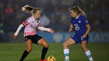 KINGSTON UPON THAMES, ENGLAND - DECEMBER 11: Amalie Eikeland of Reading and Erin Cuthbert of Chelsea battle for the ball during the FA Women's Super League match between Chelsea and Reading at Kingsmeadow on December 11, 2022 in Kingston upon Thames, England. (Photo by Andrew Redington/Getty Images)