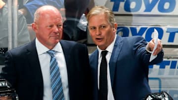 ANAHEIM, CA - FEBRUARY 13: Interim head coach of the Anaheim Ducks, Bob Murray, chats with assistant coach, Mark Morrison while coaching first NHL game on February 13, 2019 against the Vancouver Canucks at Honda Center in Anaheim, California. (Photo by Debora Robinson/NHLI via Getty Images)