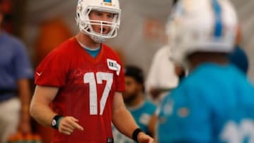 Jun 17, 2014; Davie, FL, USA; Miami Dolphins quarterback Ryan Tannehill (17) reacts during mini-camp at Miami Dolphins Training Facility. Mandatory Credit: Robert Mayer-USA TODAY Sports