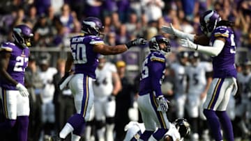 MINNEAPOLIS, MN - OCTOBER 22: Eric Wilson #50 and Emmanuel Lamur #59 of the Minnesota Vikings celebrate a tackle by teammate Marcus Sherels #35 at the end of the first half of the game against the Baltimore Ravens on October 22, 2017 at U.S. Bank Stadium in Minneapolis, Minnesota. (Photo by Hannah Foslien/Getty Images)
