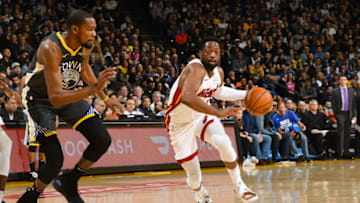 OAKLAND, CA - FEBRUARY 10: Dwyane Wade #3 of the Miami Heat dribbles the ball during the game against Kevin Durant #35 of the Golden State Warriors on February 10 at ORACLE Arena in Oakland, California. NOTE TO USER: User expressly acknowledges and agrees that, by downloading and or using this photograph, user is consenting to the terms and conditions of Getty Images License Agreement. Mandatory Copyright Notice: Copyright 2019 NBAE (Photo by Noah Graham/NBAE via Getty Images)
